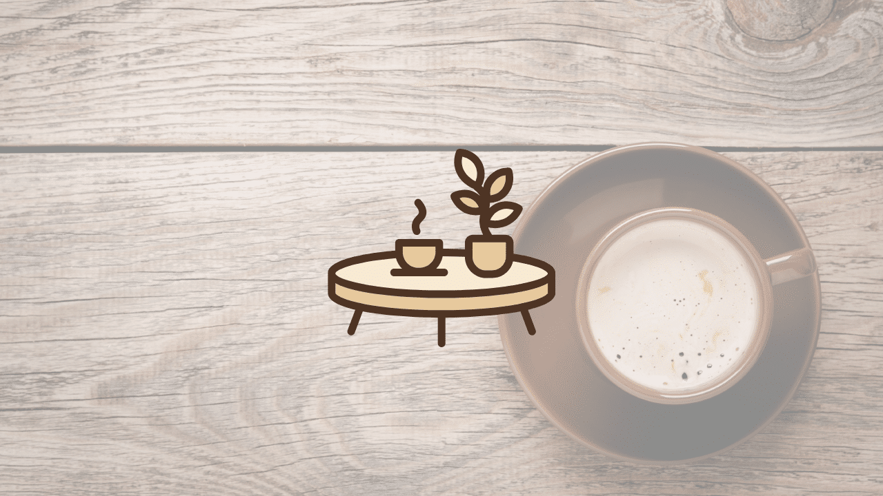 Top-down view of a coffee cup on a rustic wood surface with a minimalist custom coffee table icon overlay representing handcrafted furniture craftsmanship.