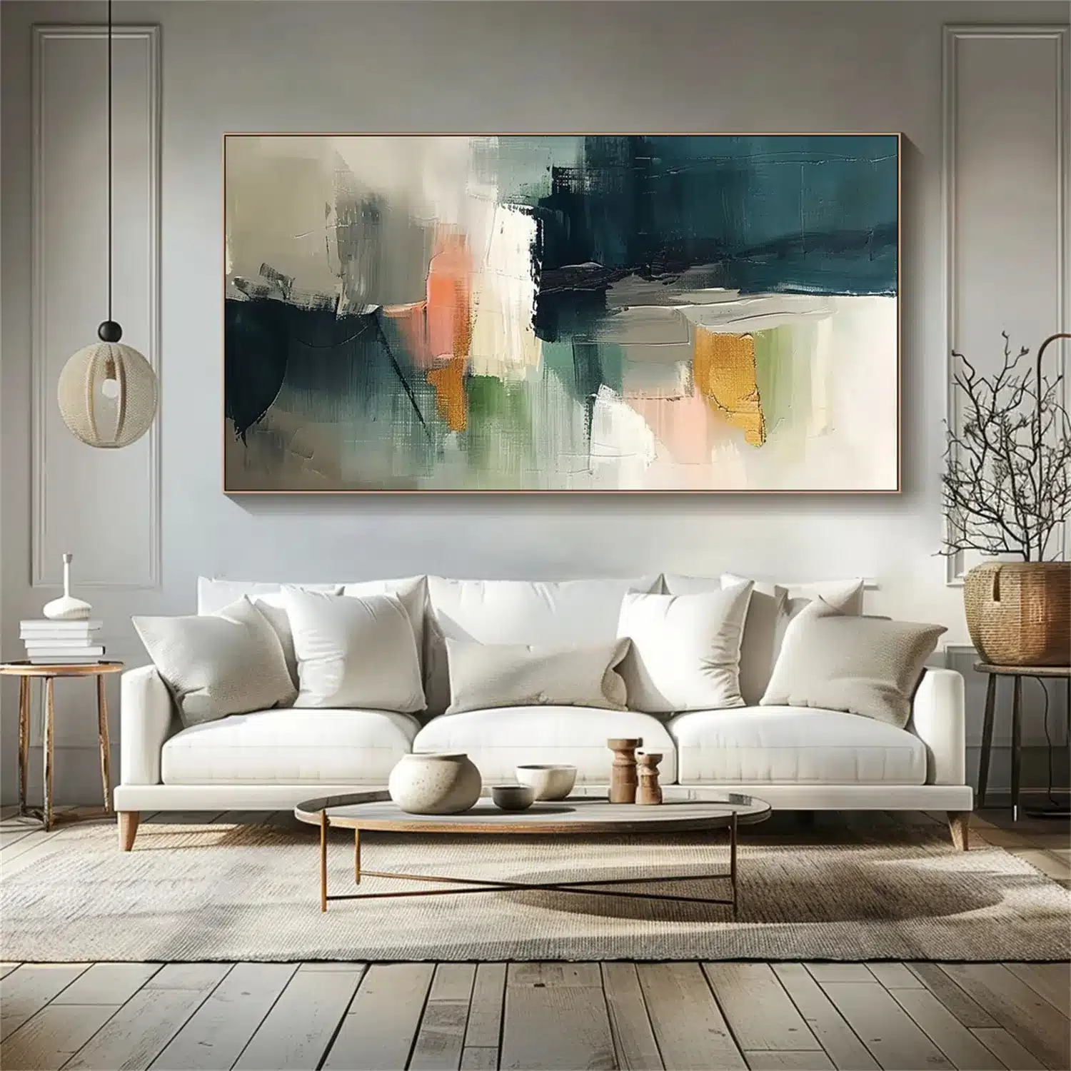 Large horizontal abstract painting with teal blue, coral, sage green, and gold accents mounted above a modern white sofa in a neutral living room.